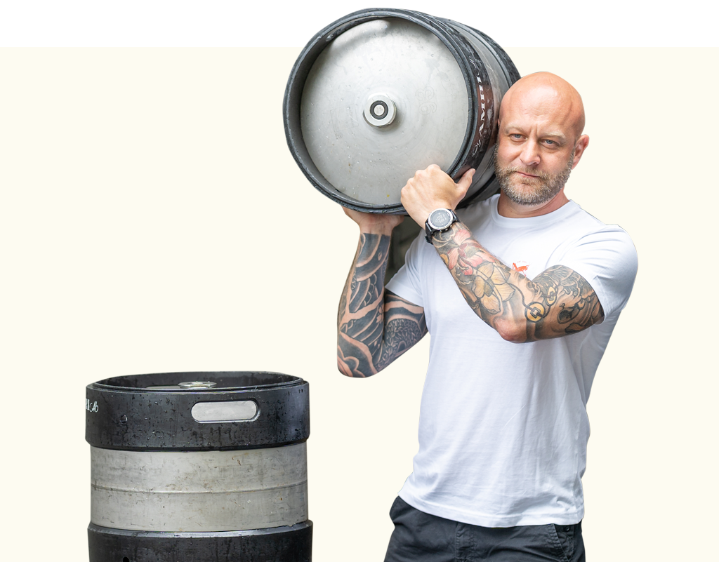 Man carrying a Mad Hopper Brewing Co. beer keg on his shoulder